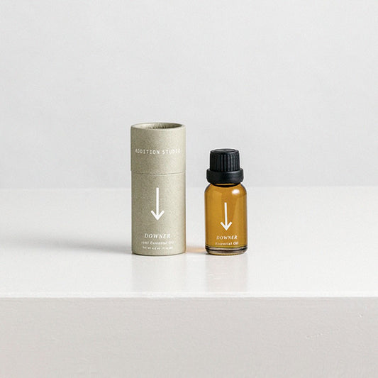 Essential Oil blend to be used in a ceramic oil burner. The oil is created by Australian brand 'Addition Studio'. This blend is called 'Downer' and is aimed to calm the user. This item is stocked online and in store at Oh Hey Grace.